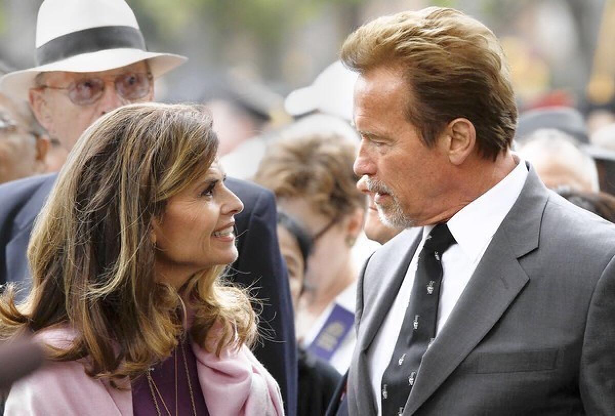 Maria Shriver and Arnold Schwarzenegger are shown at USC's commencement ceremonies in May 2012.