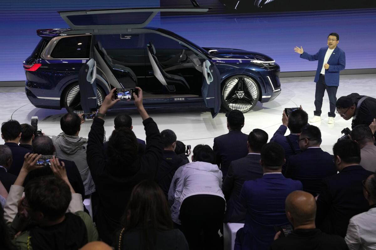 Jerry Gan, CEO of Geely Auto Group, unveils the Galaxy Starship, a new technology flagship AI-driven SUV prototype.