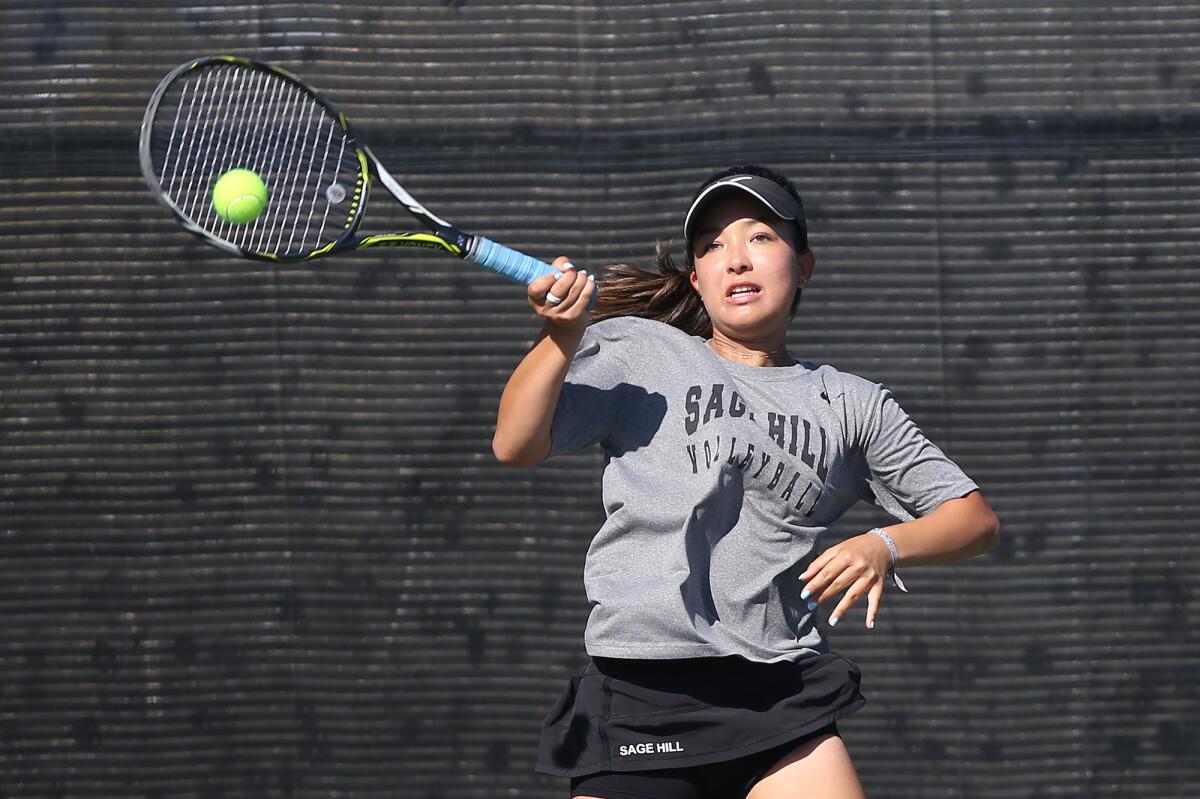 Sage Hill's Miya Stauss hits a forehand in a singles match against St. Margaret’s during a San Joaquin League match at Saddleback College on Wednesday.