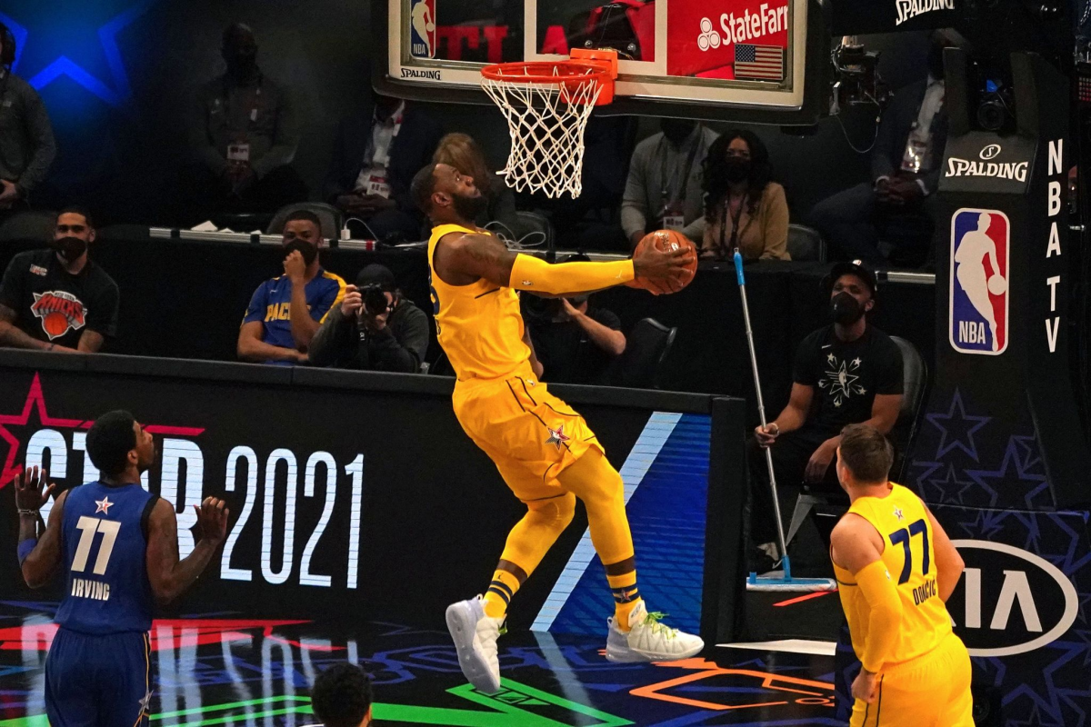 LeBron James dunks during Team LeBron's 170-150 victory over Team Durant at the NBA All-Star Game in Atlanta on Sunday.