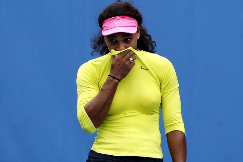 Serena Williams tries to stifle a cough during a practice session Saturday in Melbourne.
