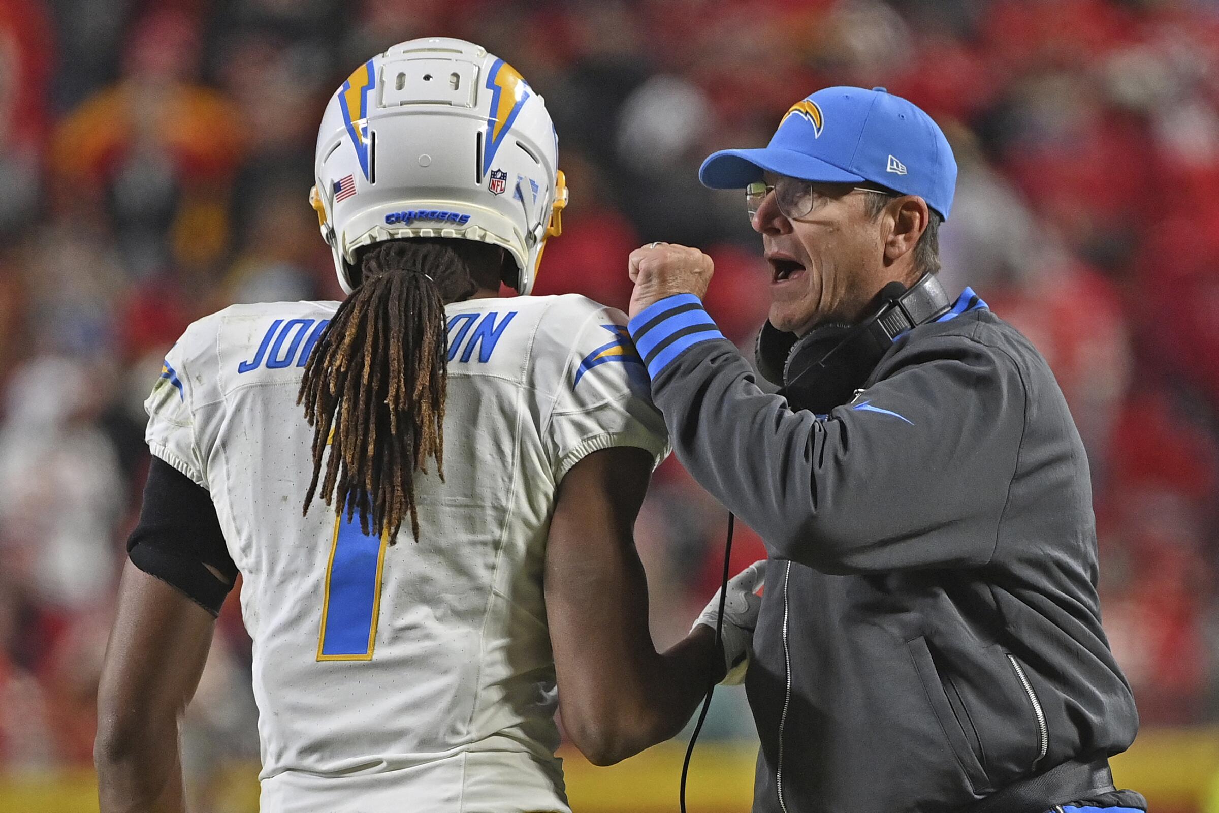 Chargers head coach Jim Harbauch celebrates with wide receiver Quentin Johnston after a Chargers touchdown Sunday.