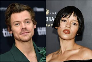 A split image of Harry Styles posing in a green suit and Taylor Russell posing in a sleeveless black dress