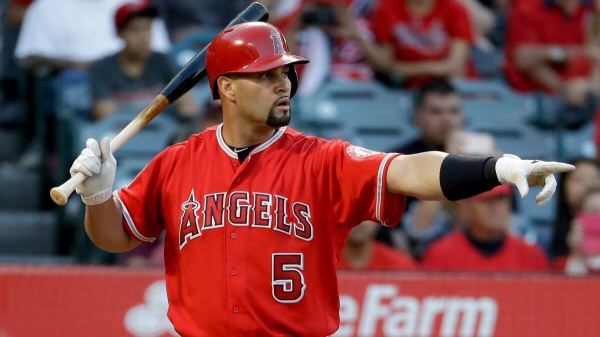 Angels' Albert Pujols points after a balk by Minnesota Twins starting pitcher Adalberto Mejia during the first inning, Thursday.