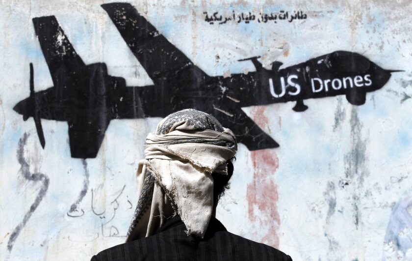 Graffiti in the Yemeni capital of Sanaa protests U.S. military operations in the war-affected country. U.S. Special Forces troops conducted a raid Jan. 29 on the town of Yakla.