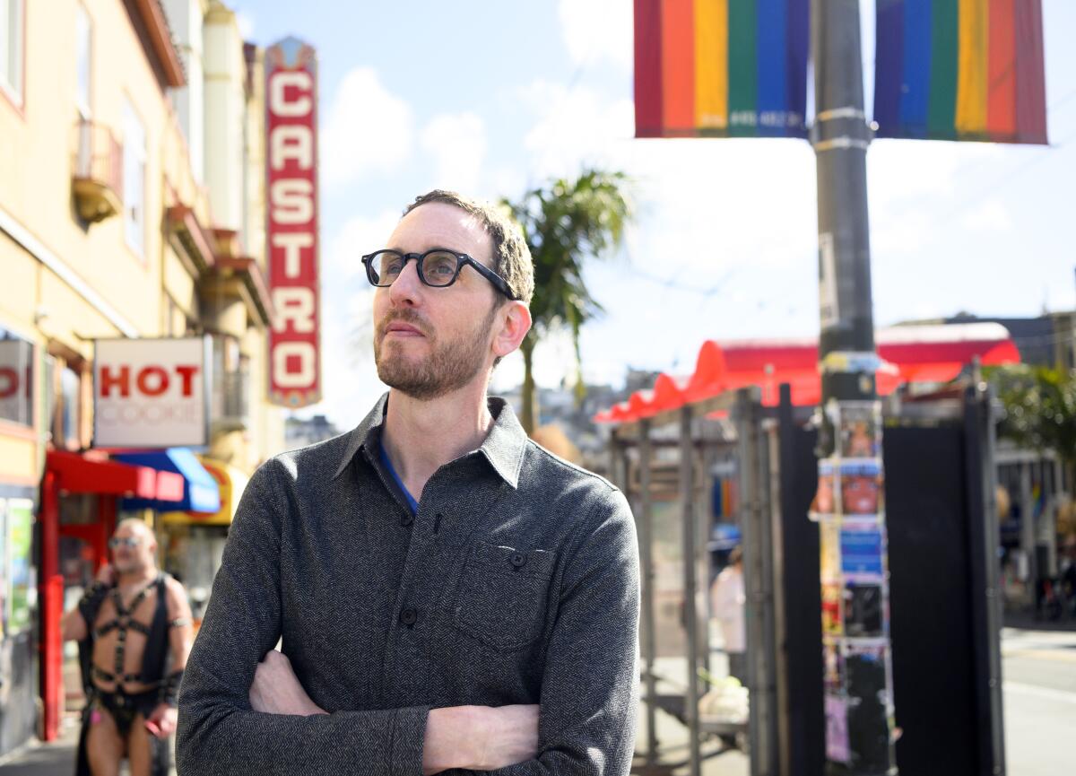 Sen. Scott Wiener stands for a photo in the Castro district in San Francisco.