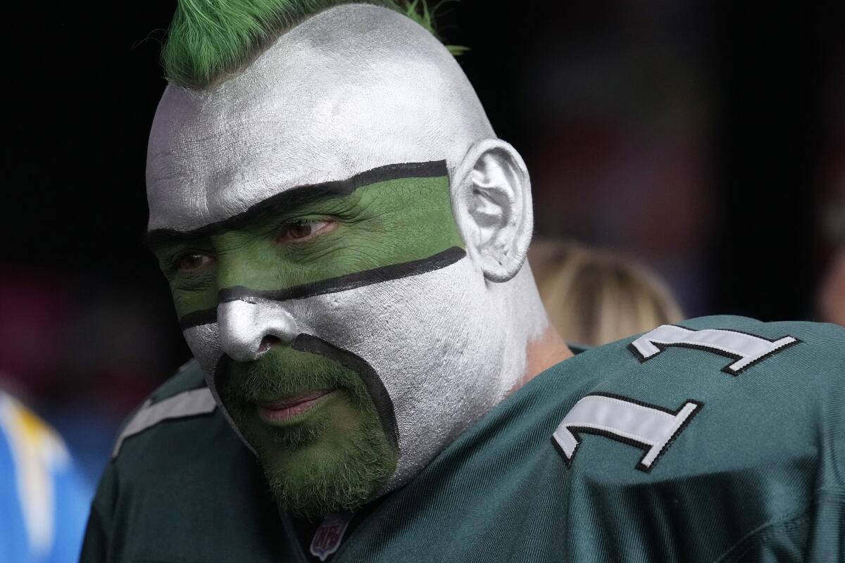 A Philadelphia Eagles fan waits before the first round of the NFL football draft