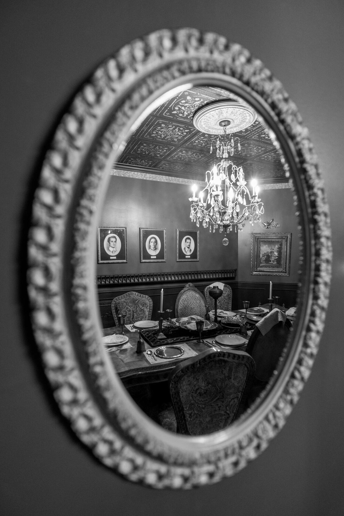 A mirror at the Ministry of Peculiarities reflects the view of a room.