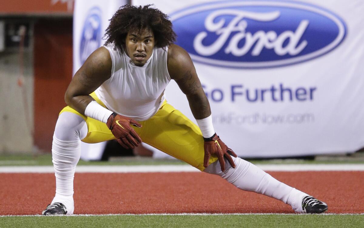 USC defensive end Leonard Williams stretches before the Trojans' game against Utah on Saturday.