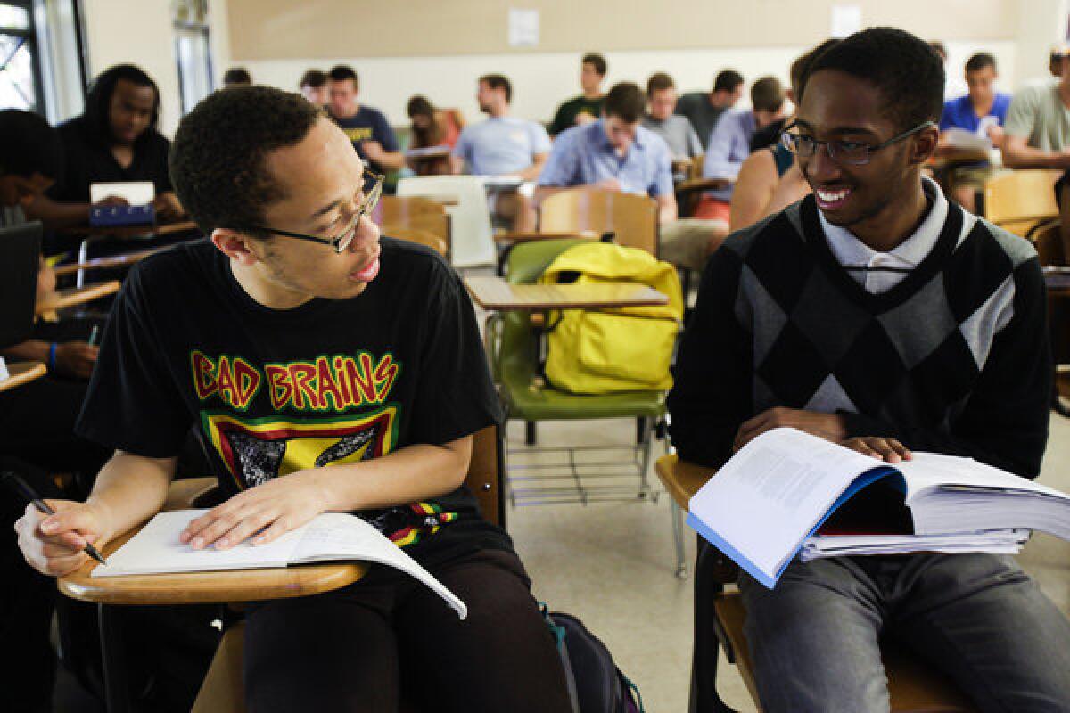 Spencer Simpson, left, and Kashawn Campbell chat before their African American studies class.