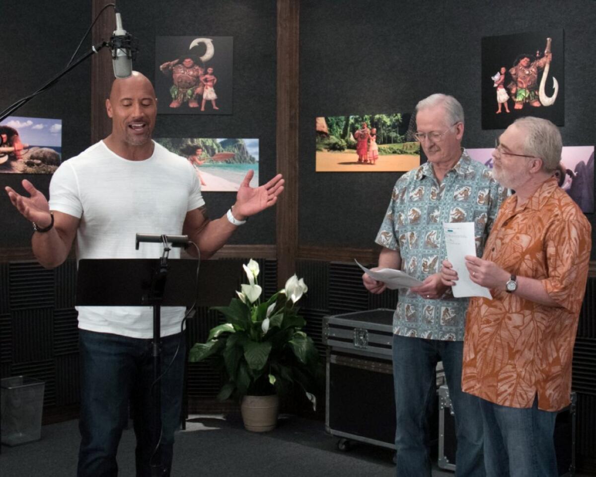 Dwayne "The Rock" Johnson with "Moana" directors John Musker, left, and Ron Clements.