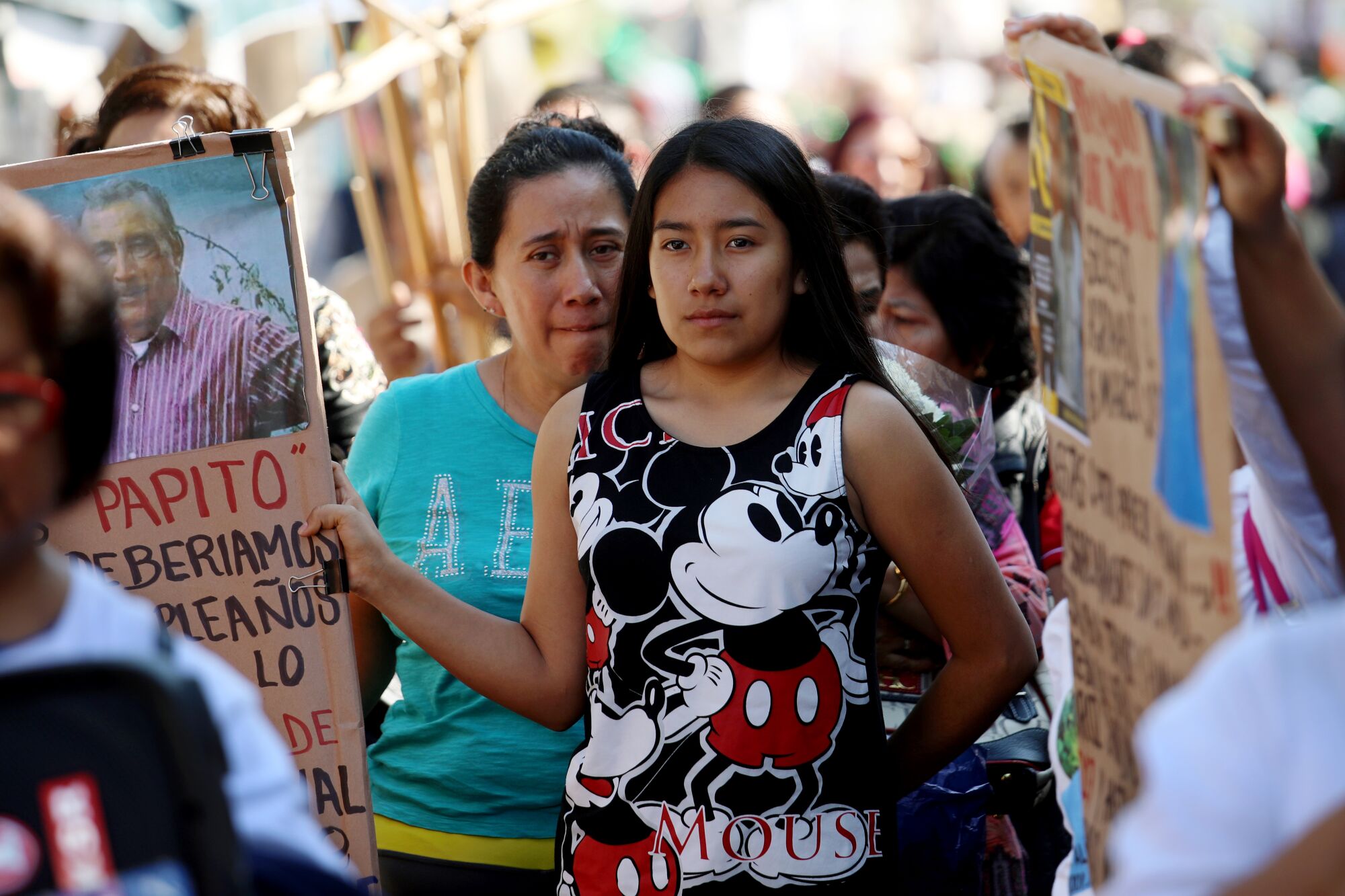 Daughter Norma Quiroz Peñaloza, left, and granddaughter Amaya Demesa Quiroz march to the site where Albino Quiroz Sandoval was last seen in Tepoztlán, Mexico.