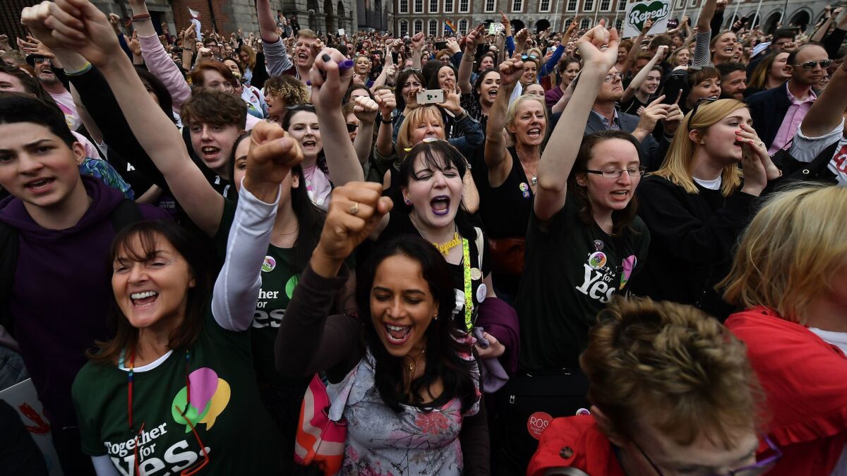 Irish voters celebrate the repeal of the country's constitutional ban on abortion on May 26, 2018, in Dublin.