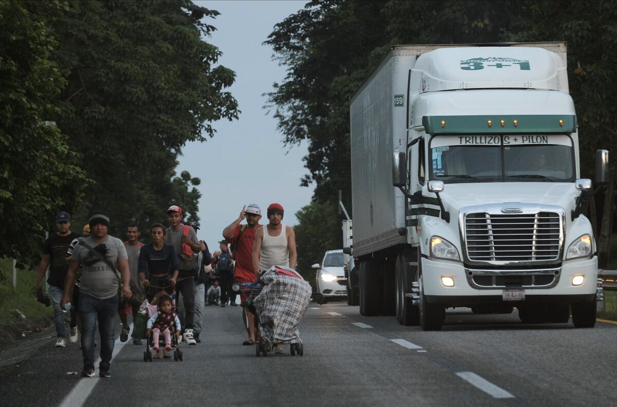 Migrants on foot along a road in Mexico's Chiapas state