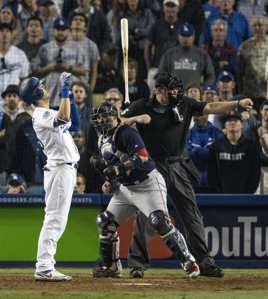 Dodgers Cody Bellinger tosses his bat after striking out in the 15th inning.