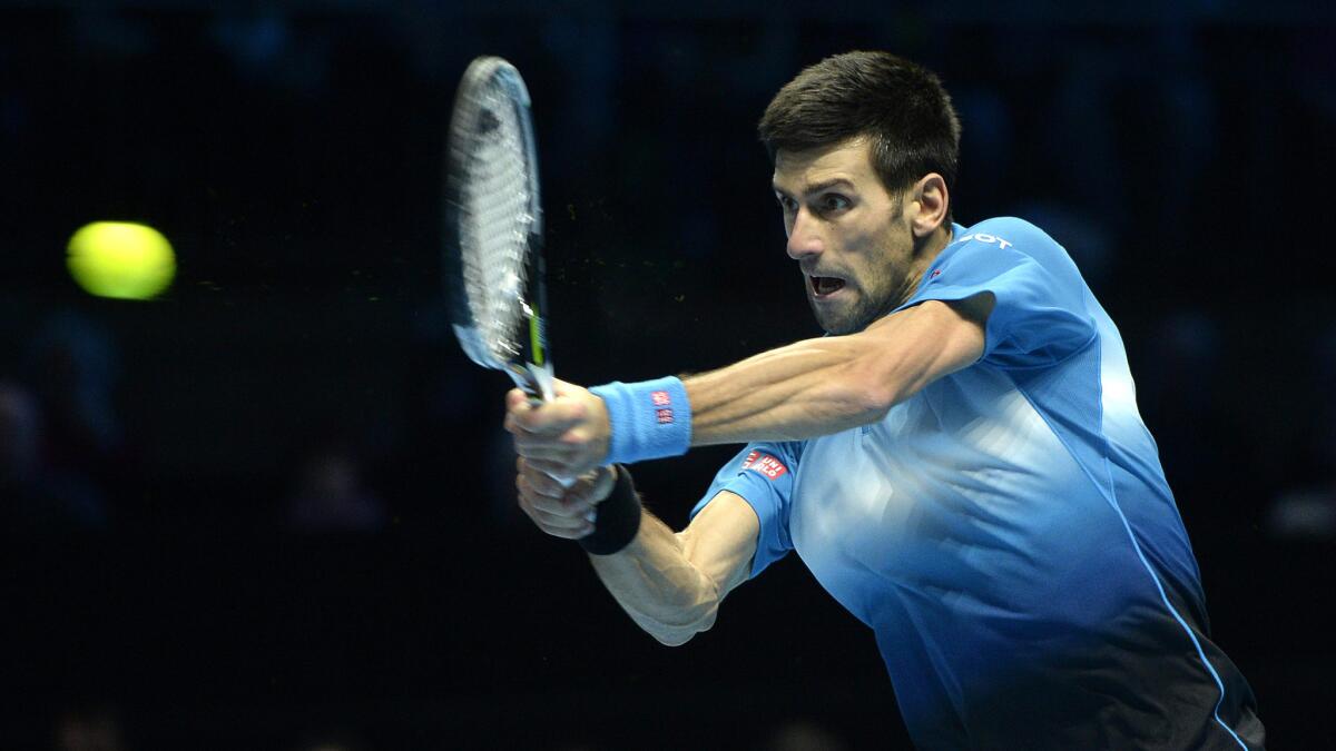 Novak Djokovic returns a shot against Rafael Nadal in the sATP Tour semifinals on Saturday in London.