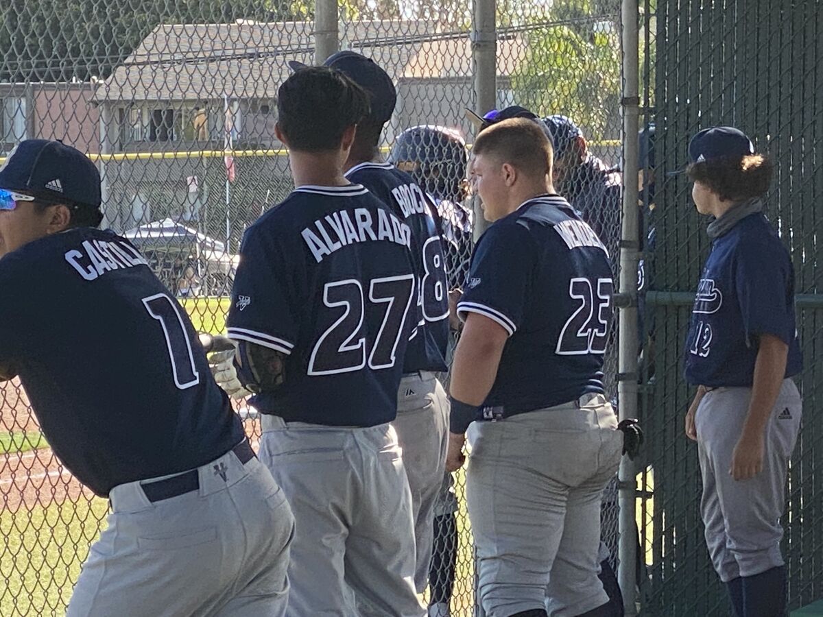 Birmingham players cheer on their teammates during 9-2 upset of top-seeded Granada Hills on Friday.