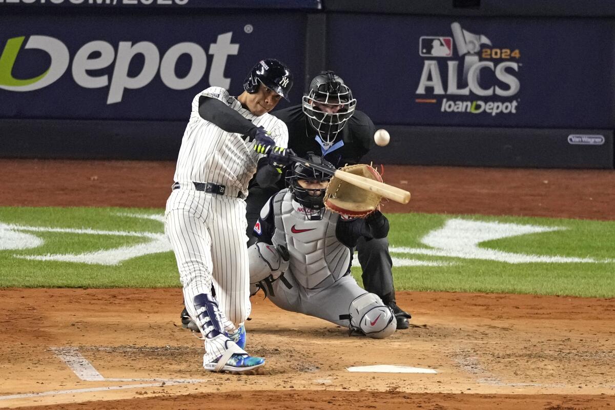 The Yankees' Juan Soto hits a home run during the third inning in Game 1 of the ALCS against the Guardians.