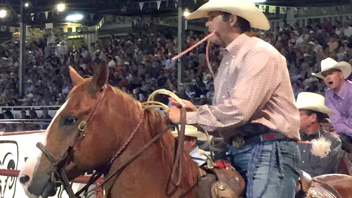 Bryce Runyan and his horse Bruce prepare for competition in Prescott, Ariz.