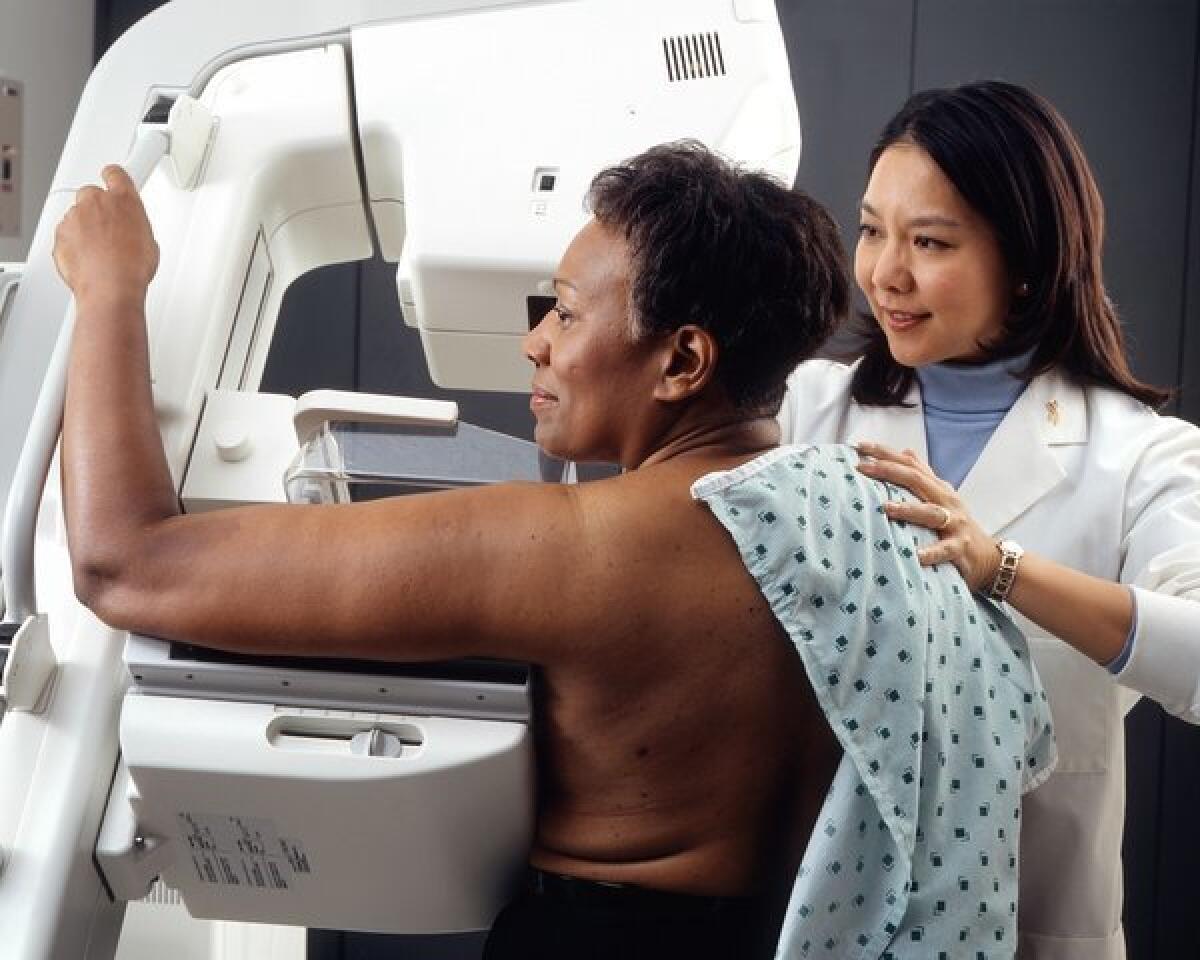 A woman receives a mammogram. On Monday, a U.S. panel updated recommendations on genetic screening for certain mutations in genes that can increase breast and ovarian cancer risk.
