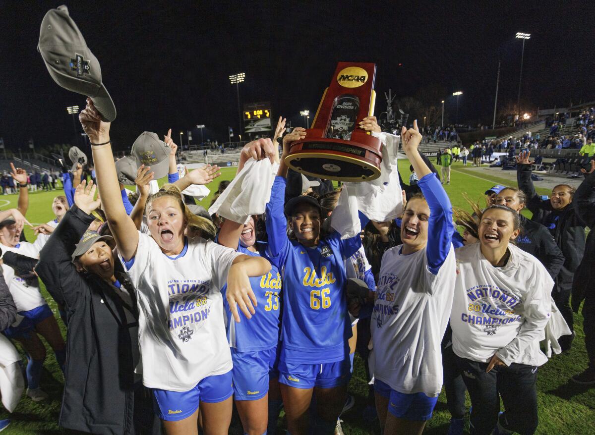 UCLA players celebrates after defeating North Carolina for the NCAA women's soccer title Monday night.