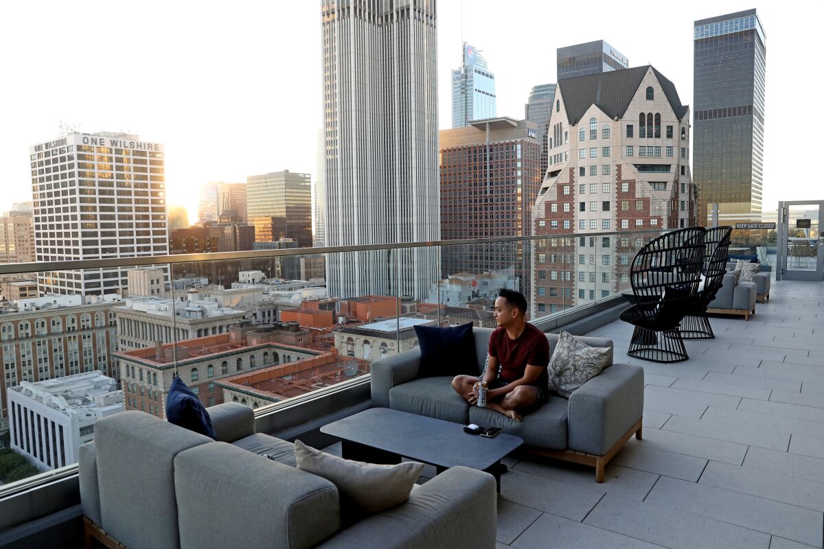 Resident Kevin Aquino relaxes on the rooftop deck. 