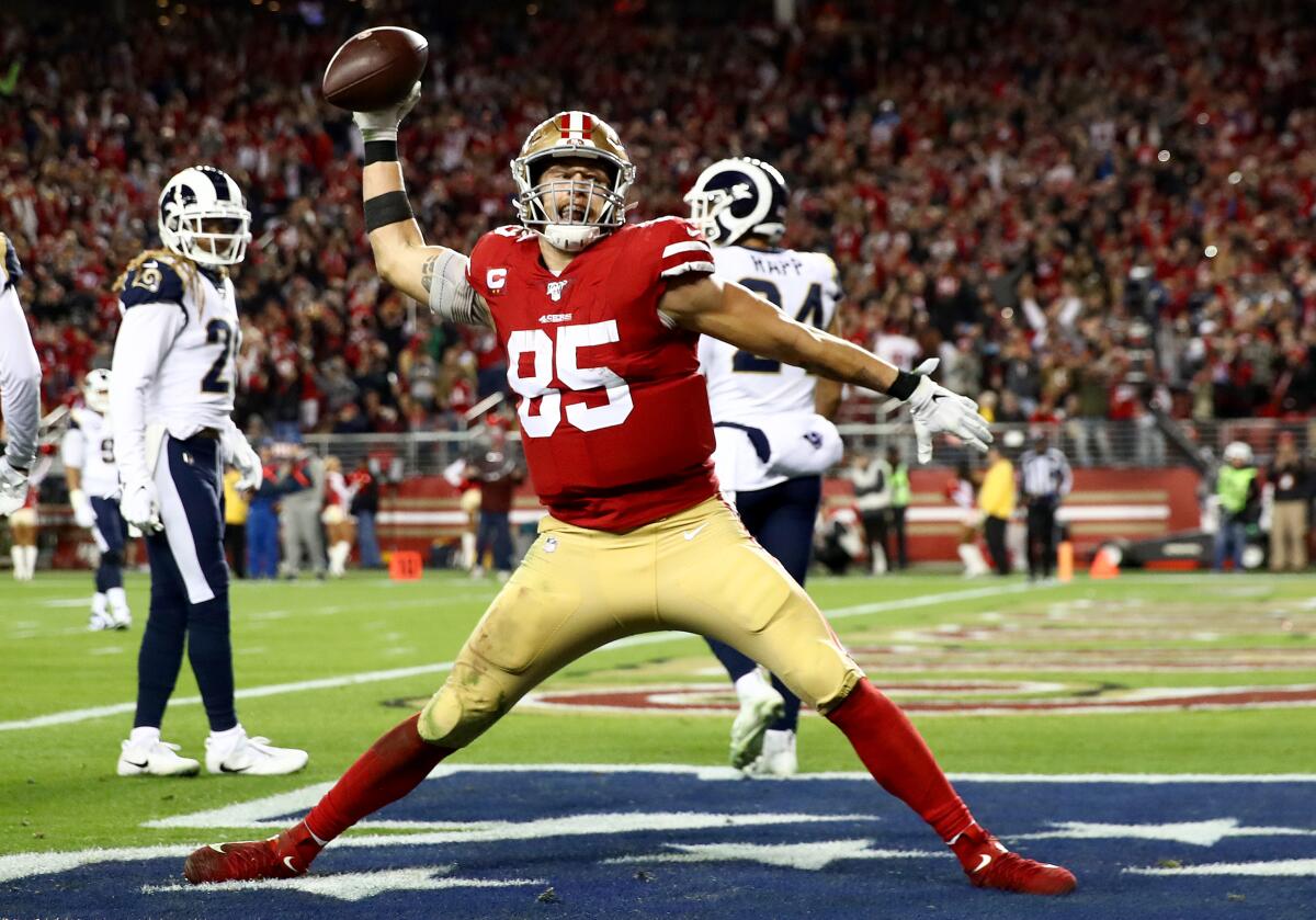 Tight end George Kittle spikes the ball after scoring a touchdown against the Rams on Dec. 21 at Levi's Stadium.