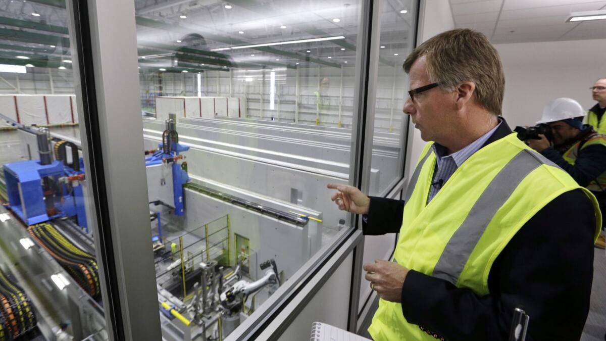 Eric Lindblad, the executive in charge of Boeing's 737 Max program, looks over the clean-room area of the new 777X Composite Wing Center.