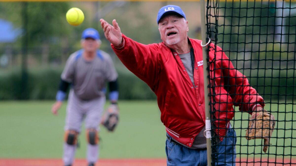 Les Beccue, 81, of Escondido, pitches for the Gaspar team in the North County Senior Softball league at Alga Norte Community Park in Carlsbad.