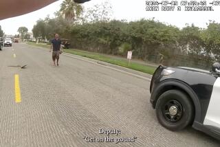 An Orange County deputy's body cam video shows Joseph Brandon Gerdvil approaching the deputy with an item in his right hand prior to a deputy involved shooting. Gerdvil was arrested on suspicion of killing his parents and the family dog.