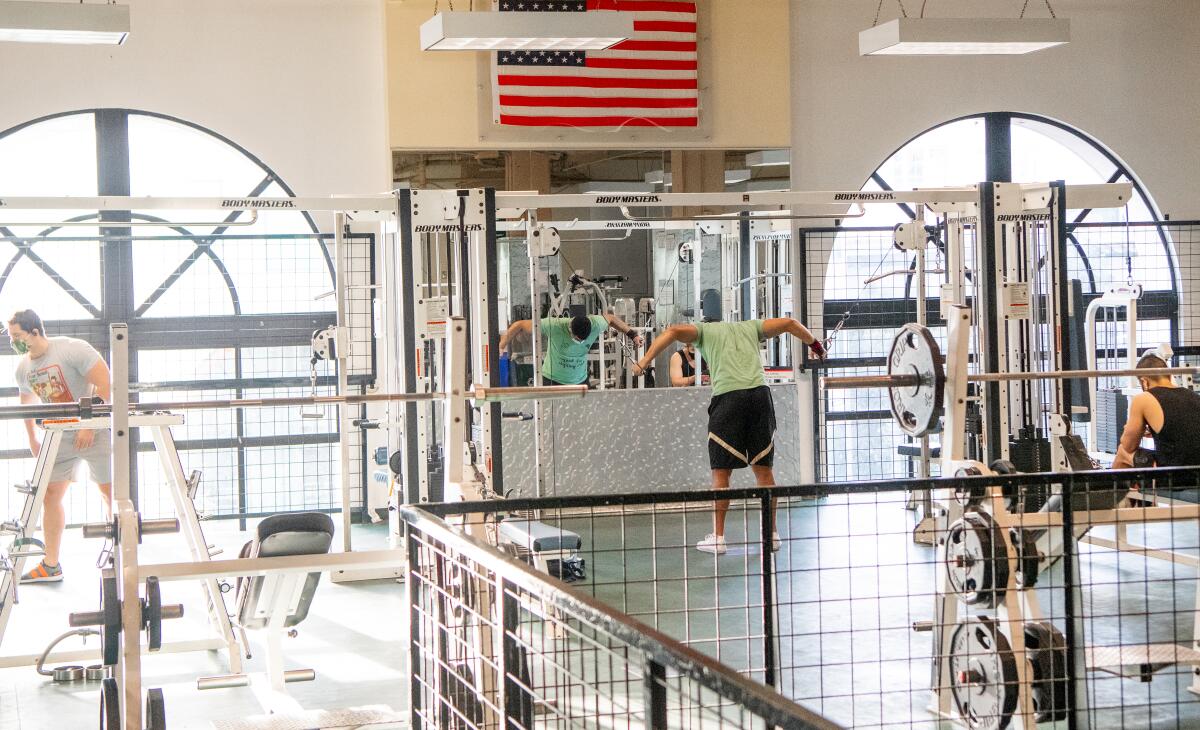 A man works works out at a 24 Hour Fitness gym in San Francisco.