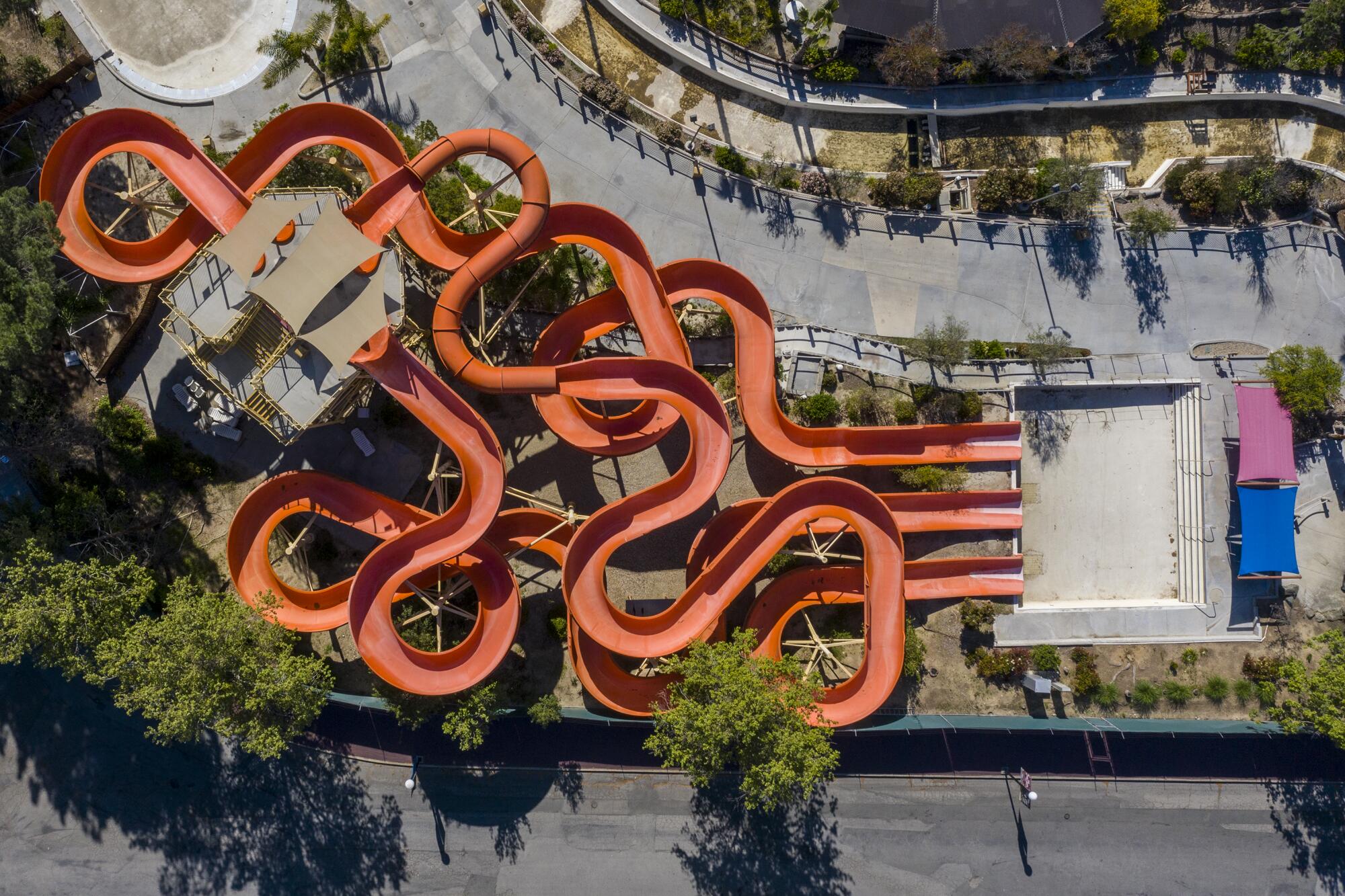 Magic Mountain's Hurricane Harbor Lightning Falls water slide sits dry during the pandemic.