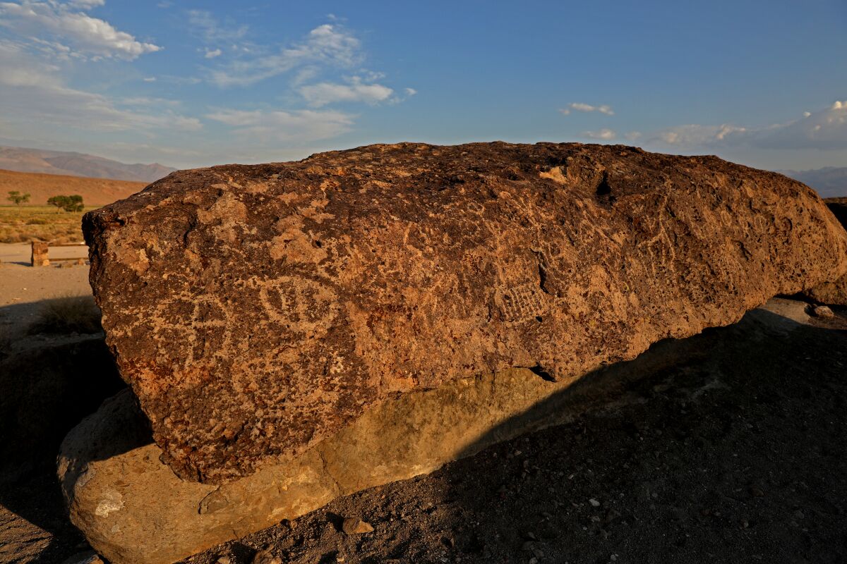 Geometric shapes, animals and human figures etched into the rocks at the Fish Slough Petroglyphs site.