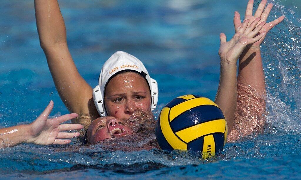 Newport Harbor High's Christina O'Beck struggles for control of a ball against Foothill's Julia Sellers during a semifinal match of the Holiday Cup on Saturday.