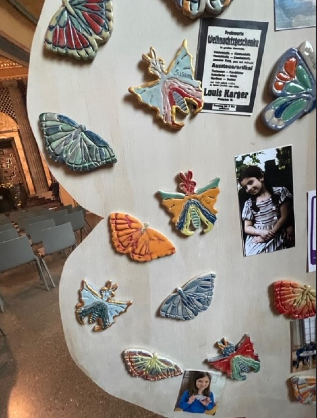 A close-up of ceramic butterflies painted in memory of young Holocaust victims by students in Görlitz, Germany, in 2023.