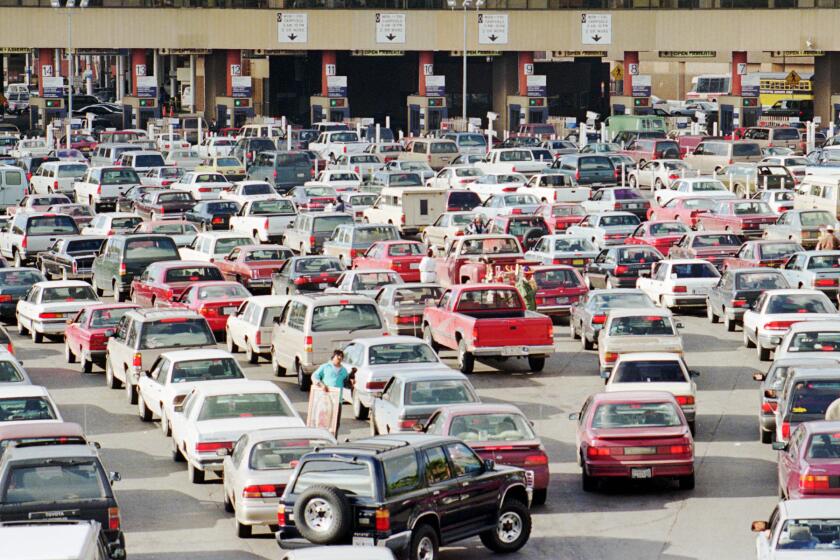 Afternoon traffic entering the U.S from Tijuana, Mexico backs up at the San Ysidro border crossing Friday Feb. 28, 1997. The border crossing is the world's busiest with over 50 million people crossing each year. U.S. officials estimate that over 70 percent of all drugs enter the U.S. from Mexico with a large pecentage of that occuring on the border between Tijuana and San Diego. (AP Photo/Denis Poroy)