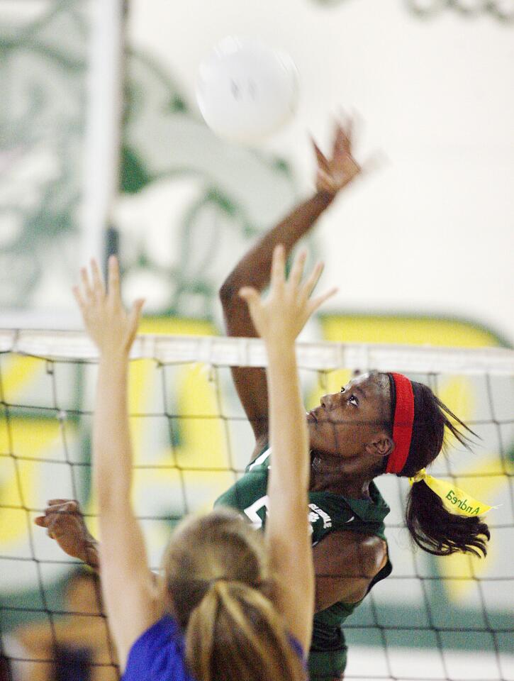 Glendale Adventist Academy's Andrea Blake spikes the ball in a kill attempt against Highland Hall.