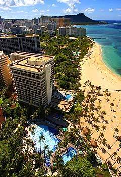 The Hilton Hawaiian Village Resort towers over the west end of Waikiki Beach.