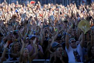 Fans cheer for Bryan Adams at the Sunset Cliffs stage at KAABOO Del Mar on Saturday, Sept. 14, 2019.