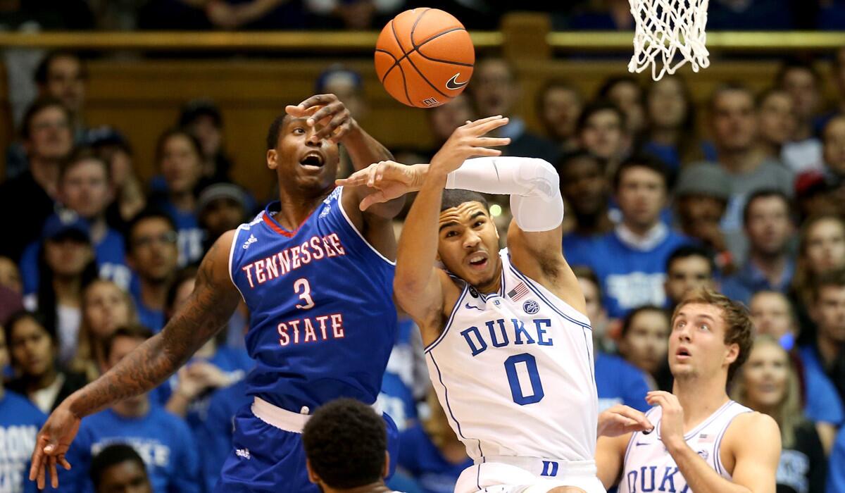 Tennessee State's Jordan Reed (3) goes after a loose ball against Duke's Jayson Tatum (0) during their game on Monday.