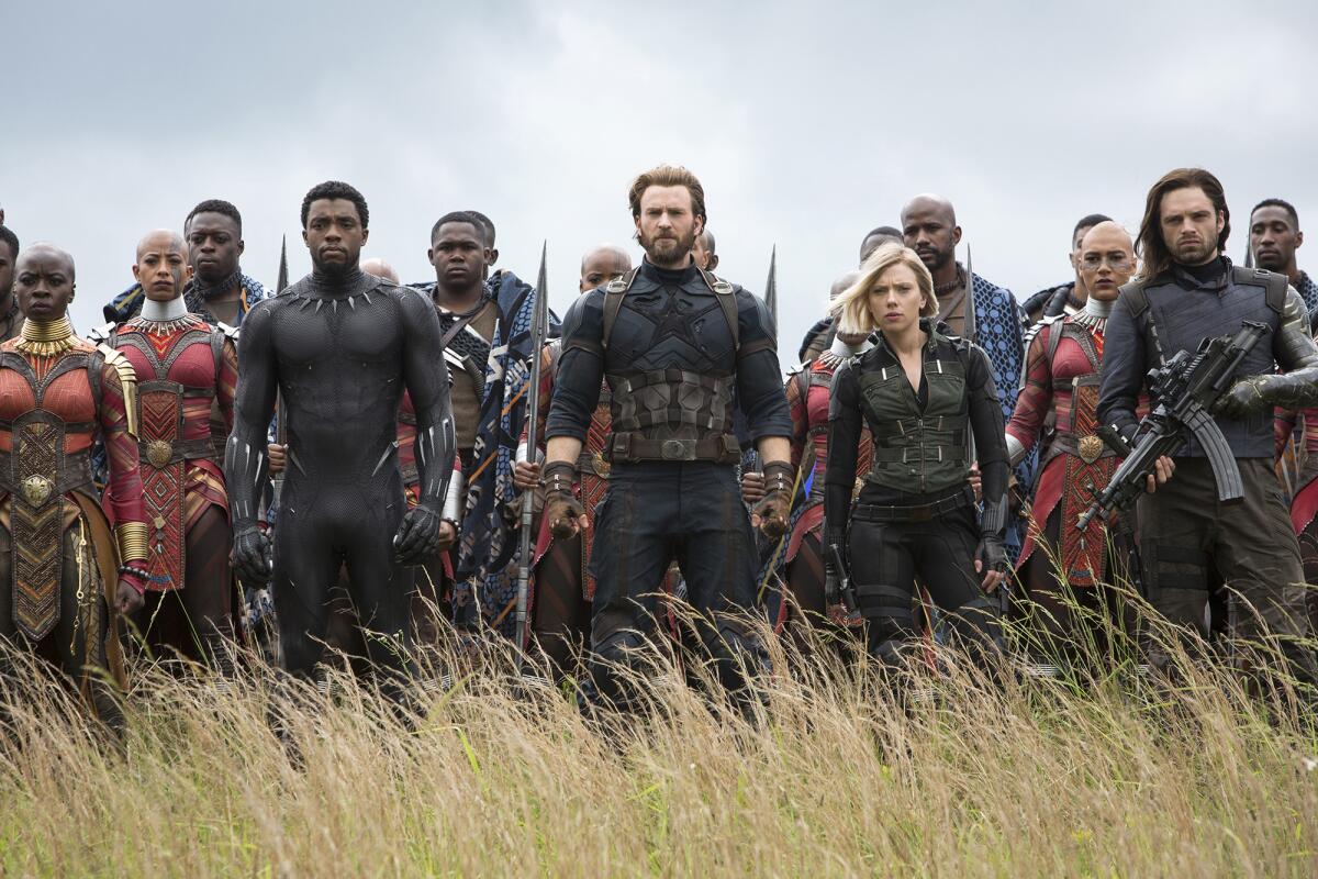 A still from 'Avengers: Infinity War' showing the characters standing in a field awaiting battle
