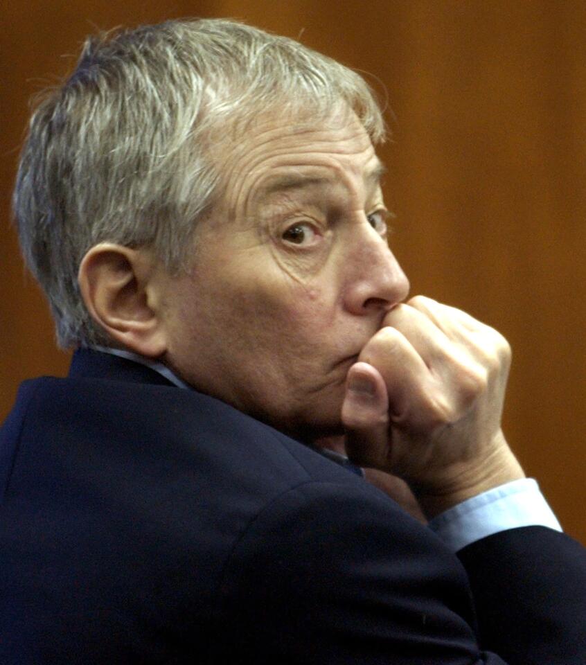 Robert Durst looks towards the back of the courtroom as attorneys meet with the judge in chambers Friday, Sept. 19, 2003, in Galveston, Texas.