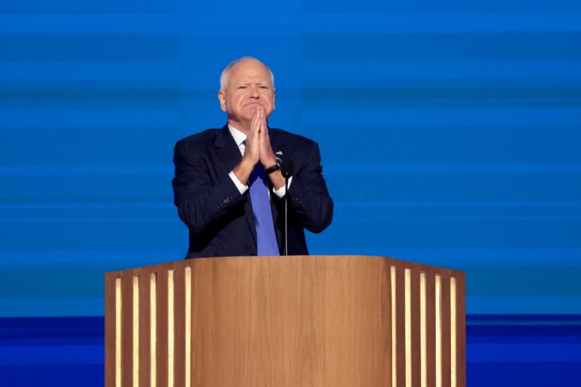 DNC CHICAGO, IL AUGUST 21, 2024 - Democratic vice presidential nominee Minnesota Gov. Tim Walz speaks during the Democratic National Convention Wednesday, Aug. 21, 2024, in Chicago, IL. (Myung J. Chun/Los Angeles Times)