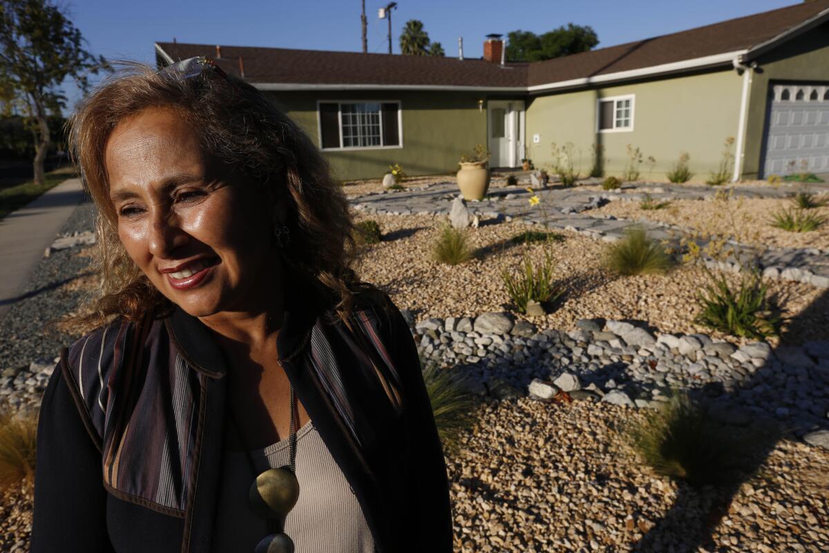 The San Fernando Valley is leading Los Angeles County in rebates. Dorian Castillo designed the drought tolerant landscaping that surrounds her house.