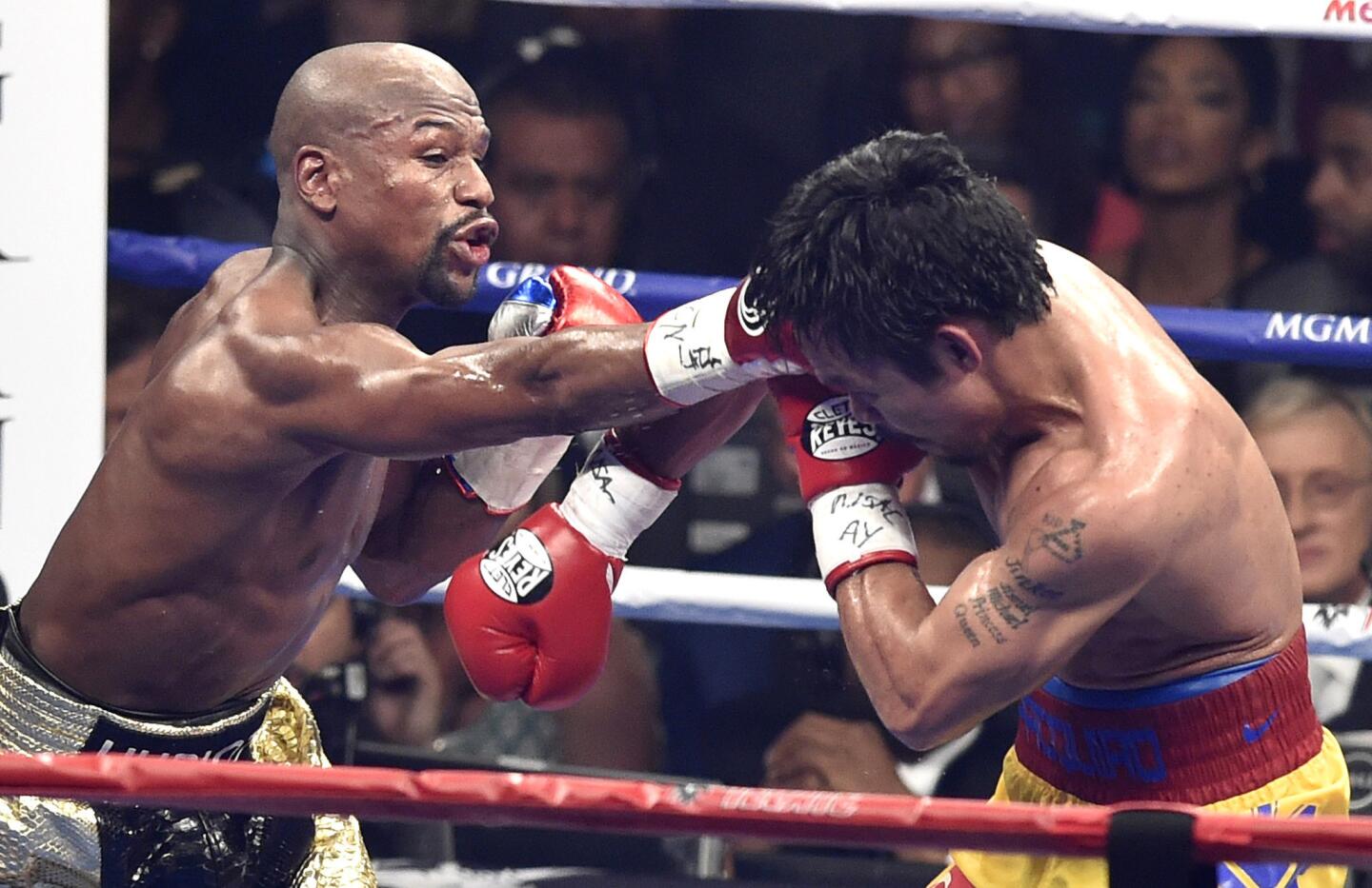 Floyd Mayweather lands a punch during the sixth round against Manny Pacquiao.