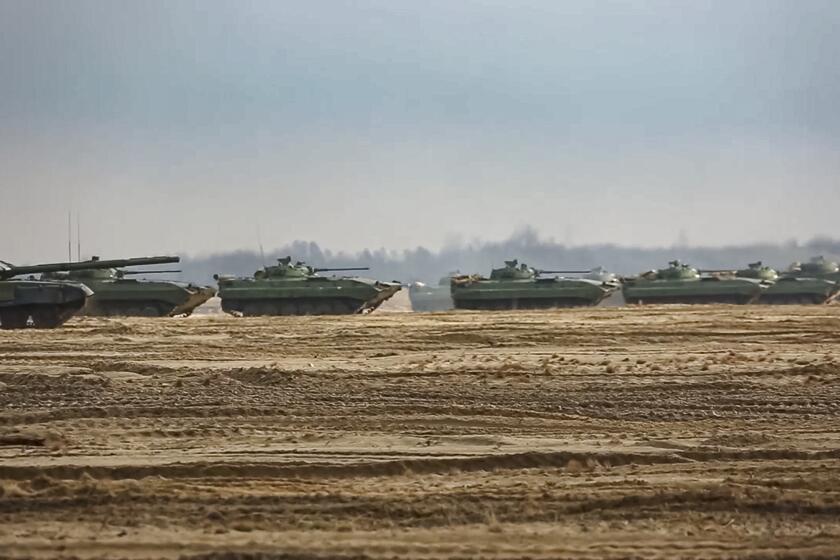 Tanks and armored vehicles move at the training ground during military drills in Belarus