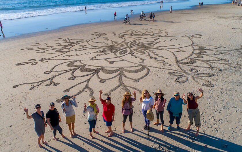 A drone’s-eye view of workshop participants with their completed artwork.