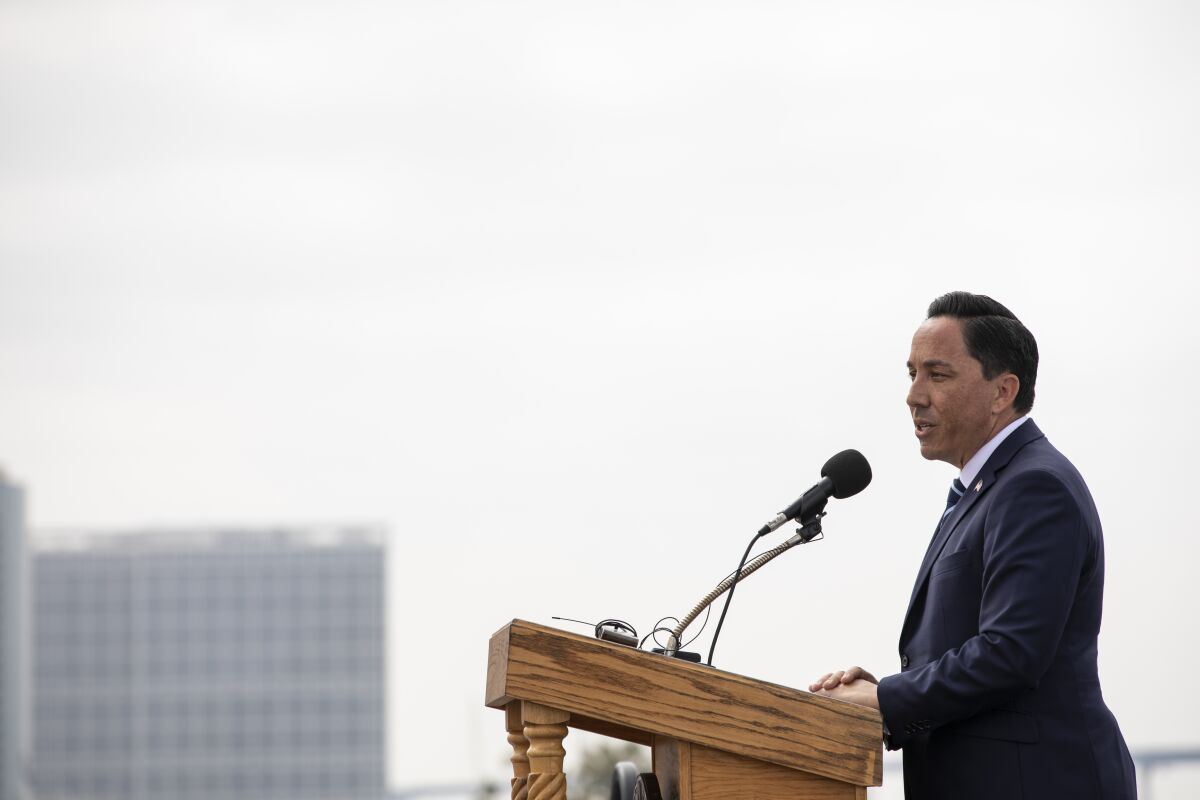 Mayor Todd Gloria speaks during a Memorial Day commemoration ceremony at the USS Midway Museum.