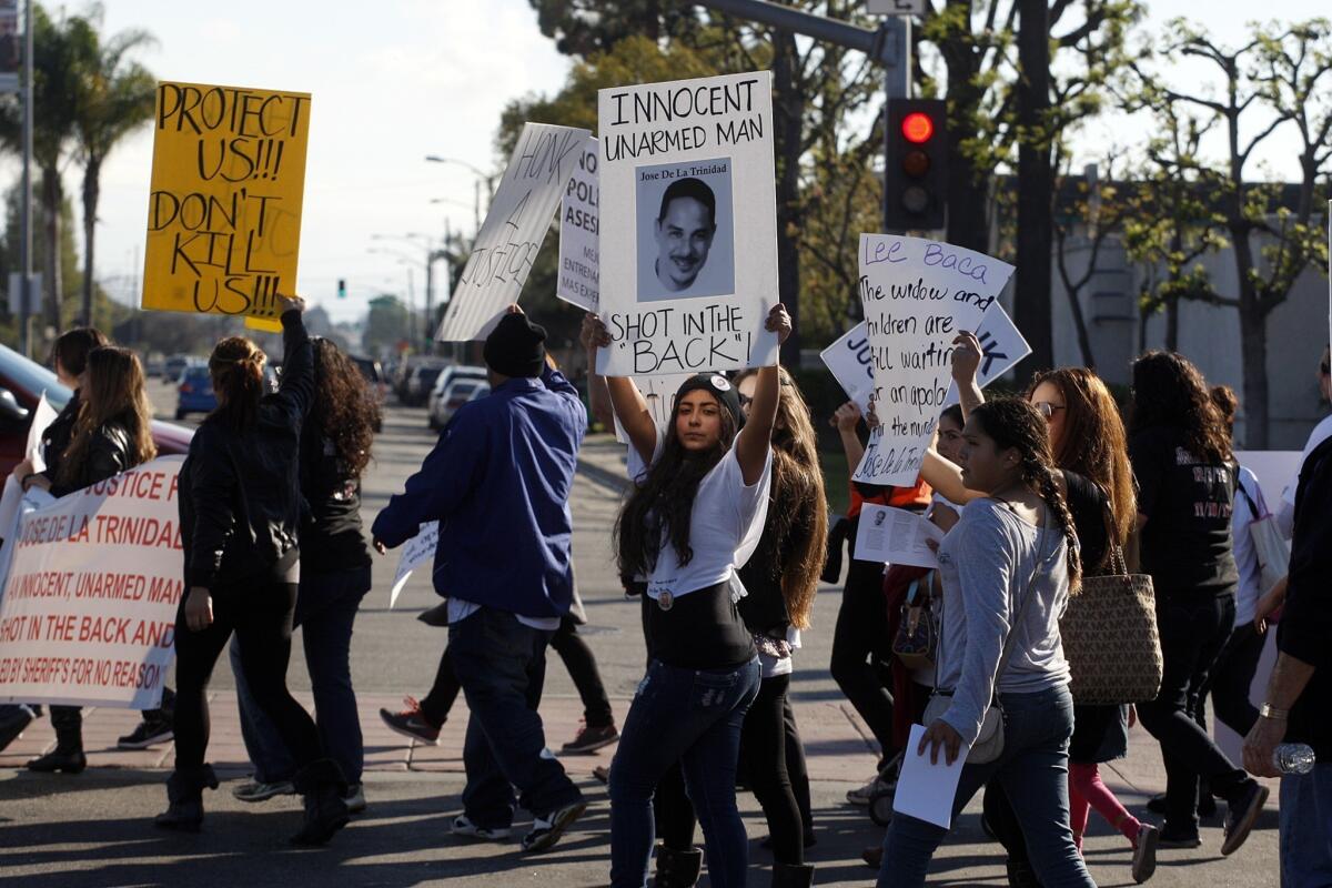 Demonstrators in Compton protest in January over the shooting death of Jose de la Trinidad by sheriff's deputies. The family is suing Los Angeles County and two deputies.