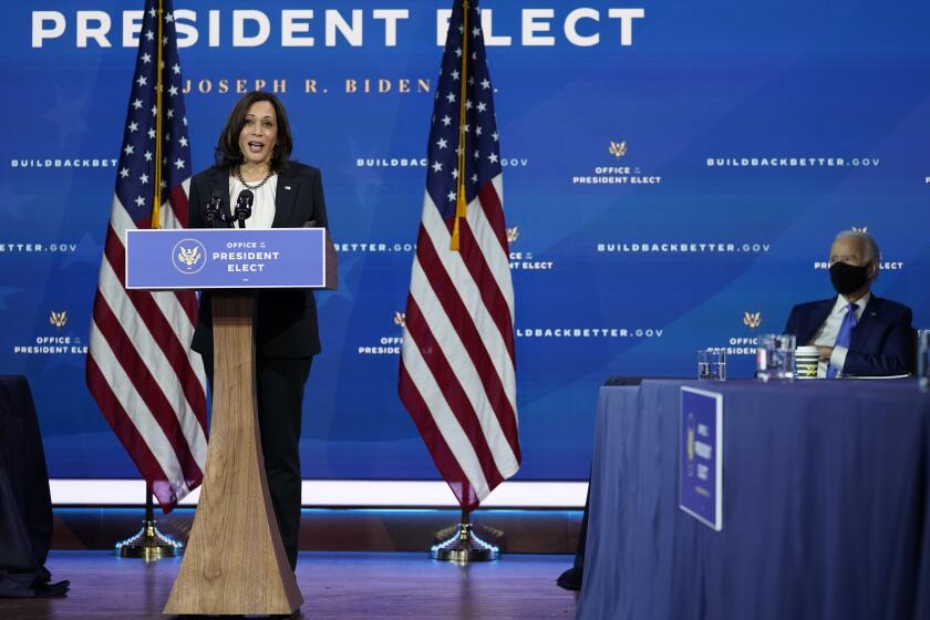 Vice President-elect Kamala Harris speaks as she and President-elect Joe Biden, at right, introduce their nominees and appointees to economic policy posts at The Queen theater, Tuesday, Dec. 1, 2020, in Wilmington, Del. (AP Photo/Andrew Harnik)